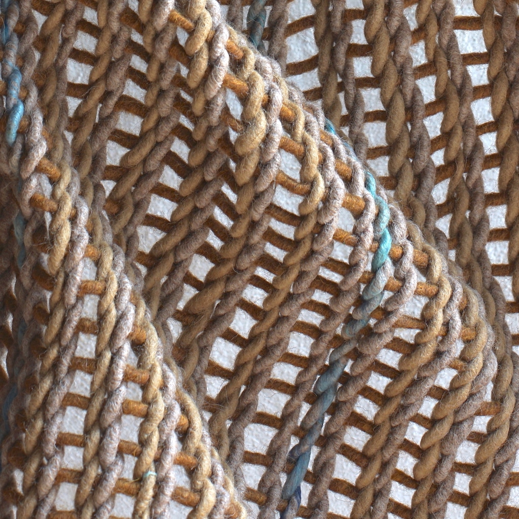Détail du tressage de feutre drapé